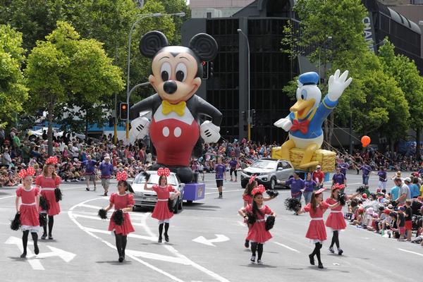 Mickey Mouse & Donald Duck giant inflatables make their way around the parade route at the Farmers Santa Parade.